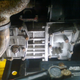 Side of transmission, underneath engine